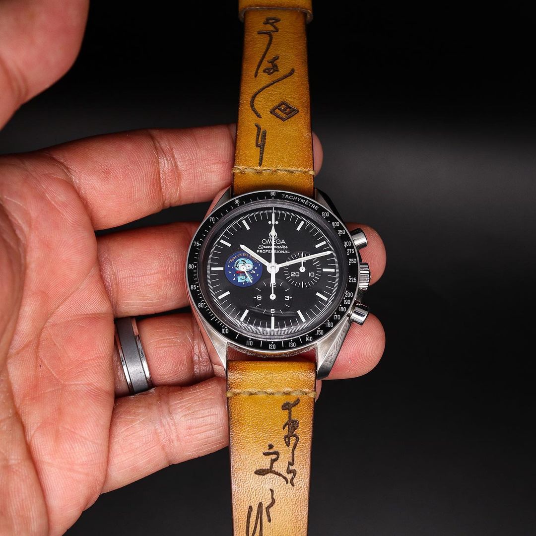 yellow brown watch strap with black dial