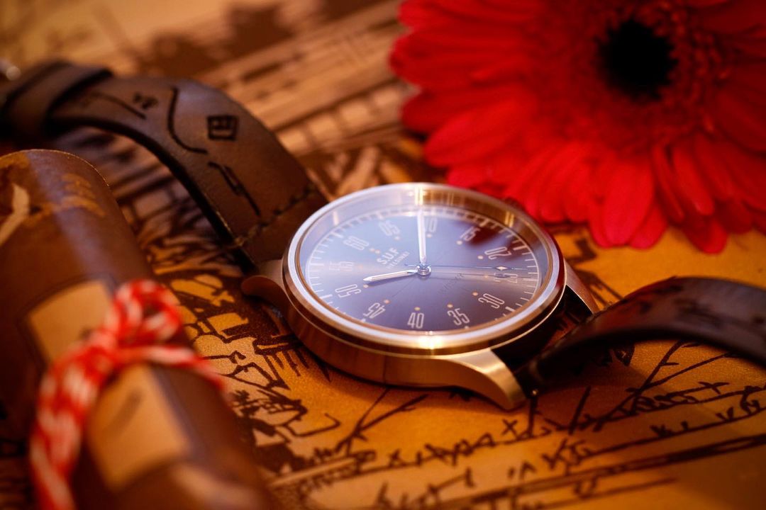 brown watch strap with black dial display