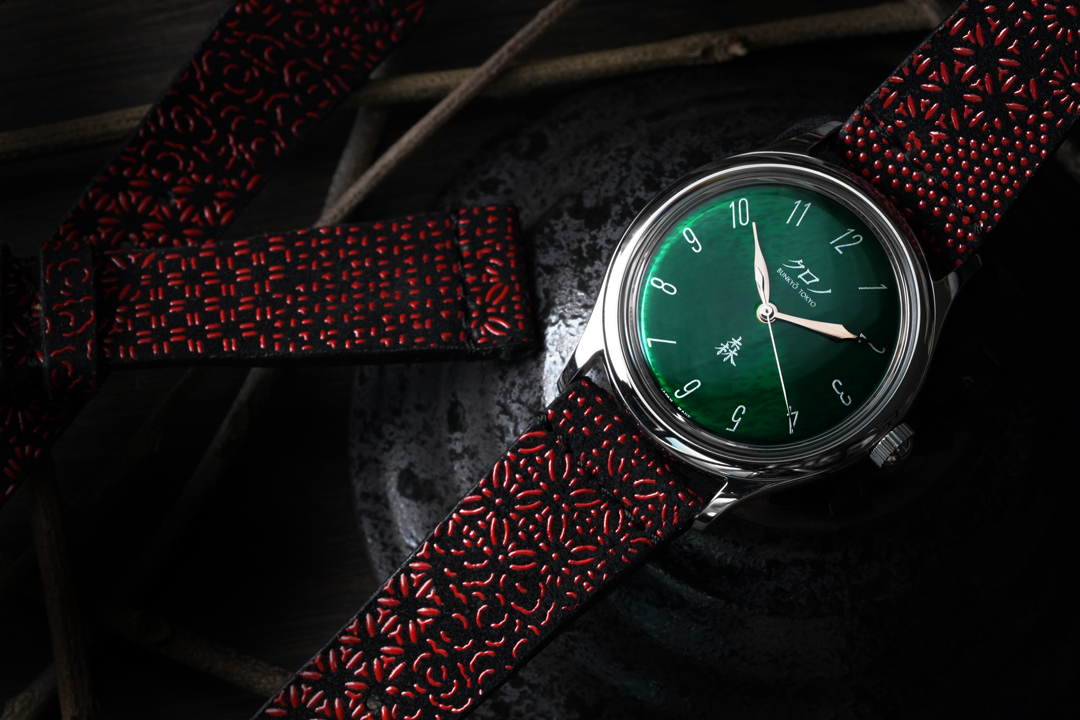 red and black strap with green dial