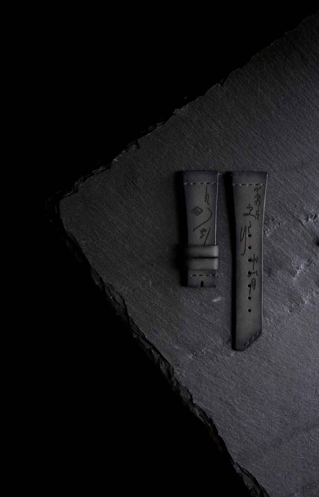 grey watch strap with stone plate background